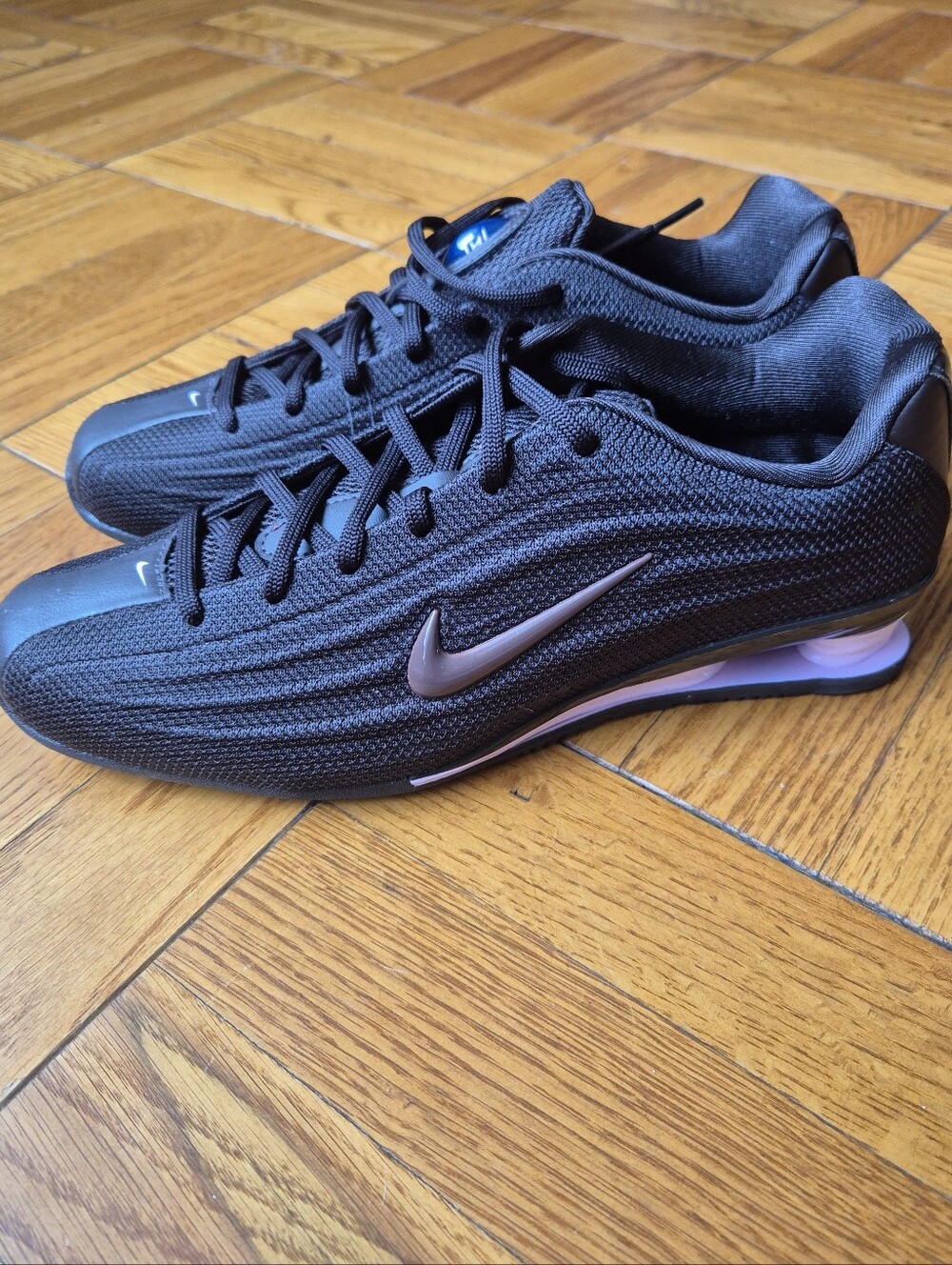 Nike Women’s Black Sneakers with Rose Metallic Swoosh